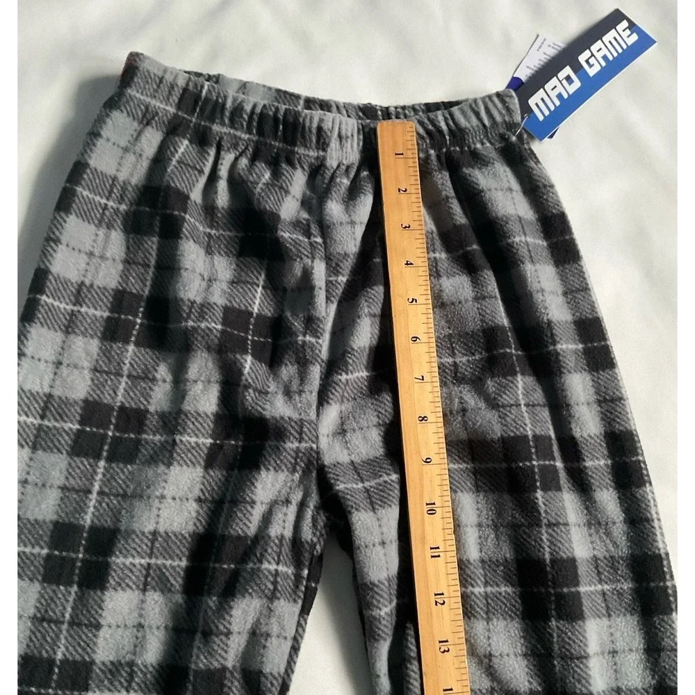 Mad Game pajama pants feature a gray and black plaid print Boys Size 8/10